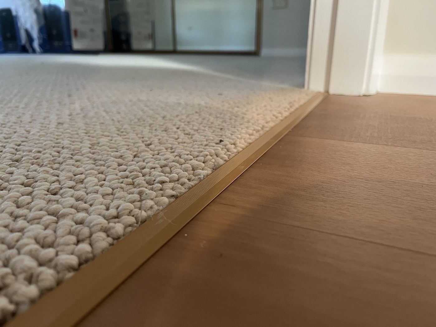 Carpet installation with timber transition detail